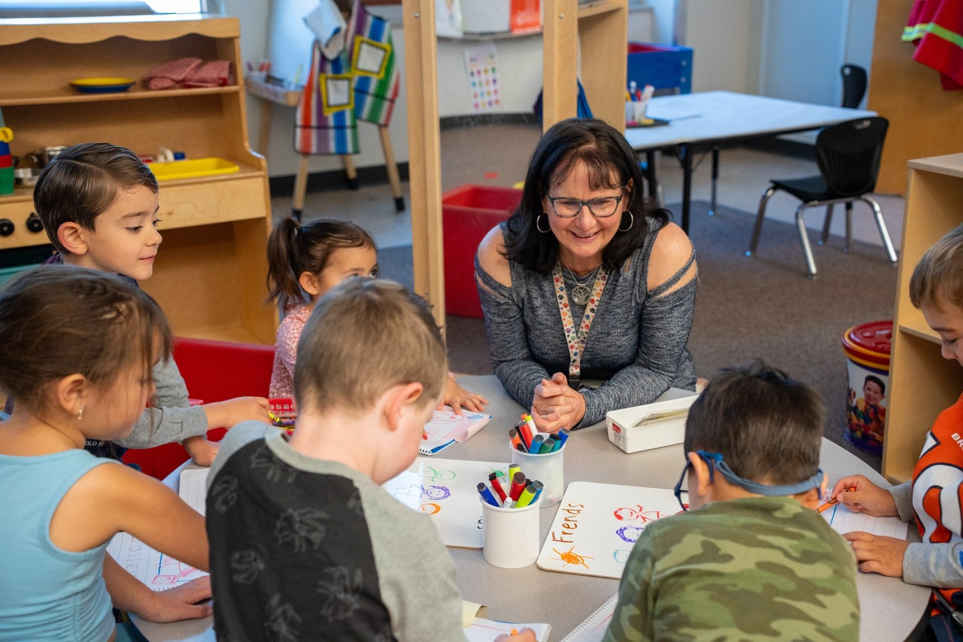 Teacher working with students